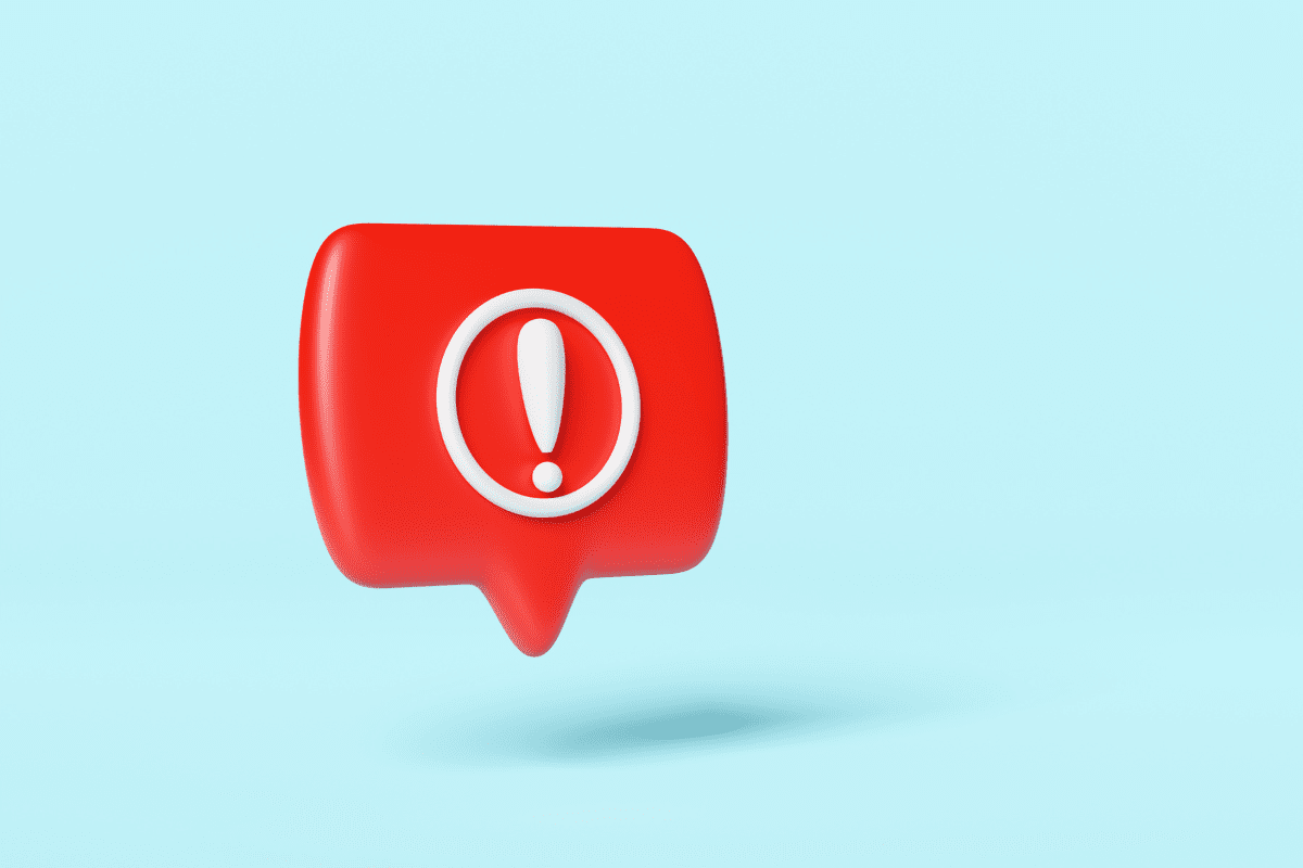 Red speech bubble with white exclamation mark on blue background