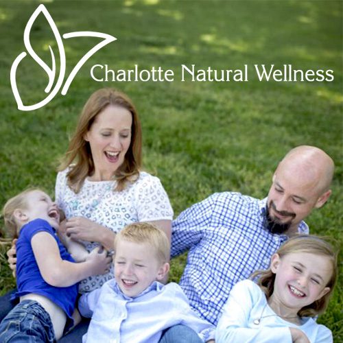 Charlotte Natural Wellness logo with happy family on the grass