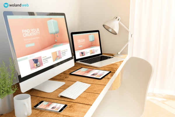 modern desk render with desktop monitor, laptop and phone with the same website showing on all 3